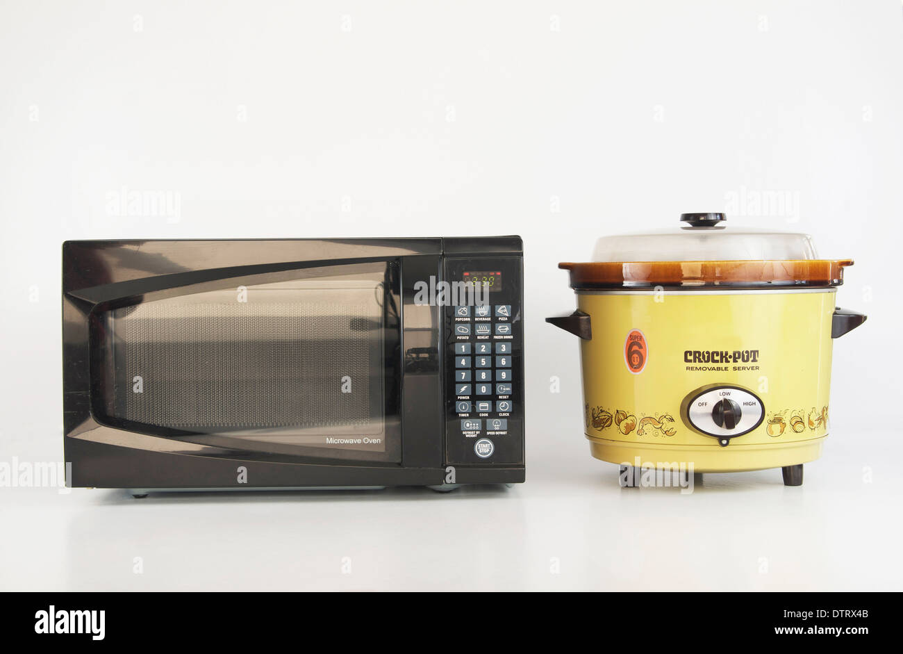 Microwave versus Slow Cooker Stock Photo