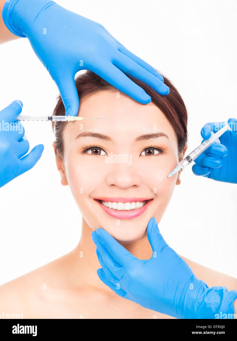 Beautiful woman gets cosmetic injections in her face Stock Photo