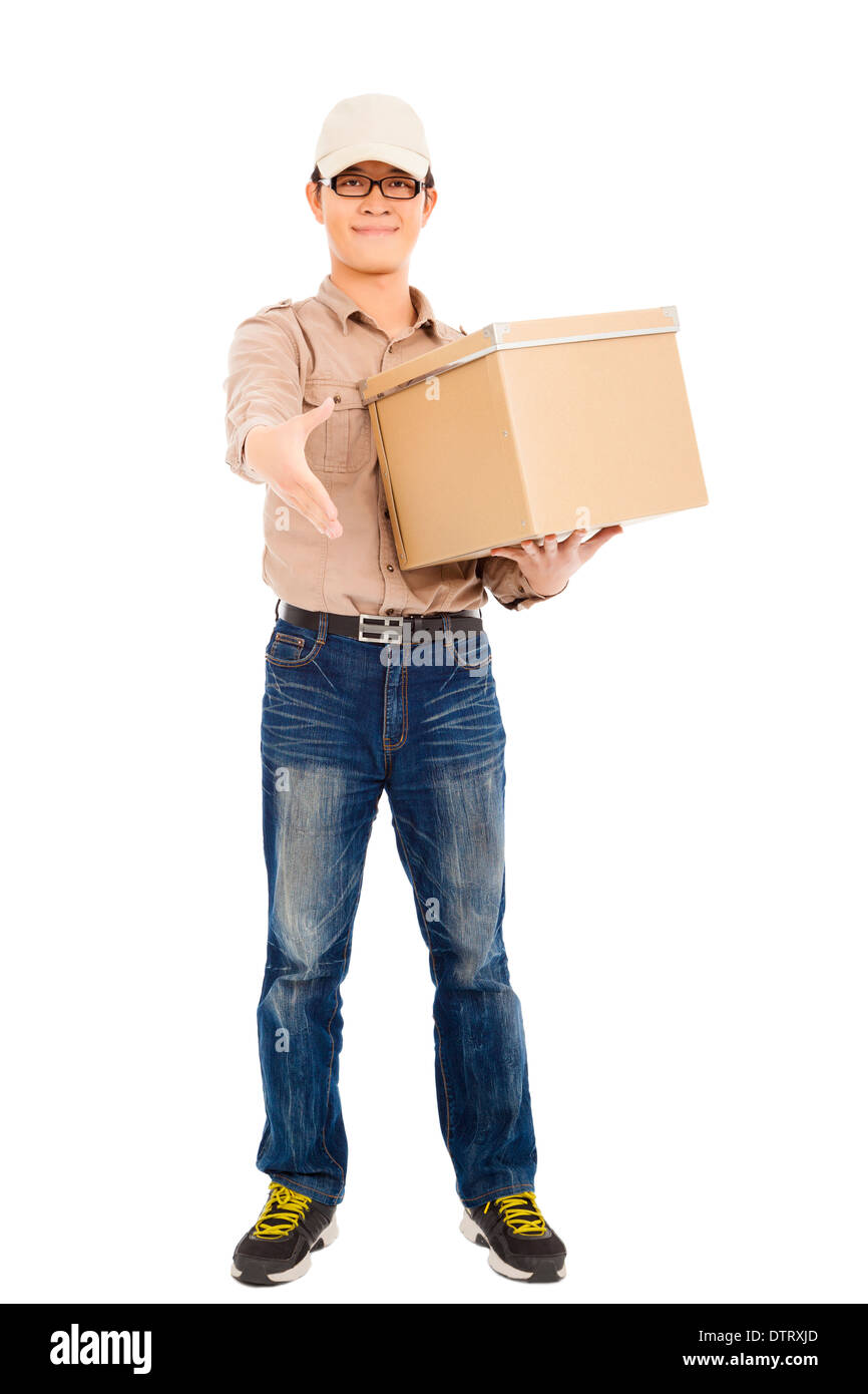 smiling delivery man holding parcel and standing over white Stock Photo ...