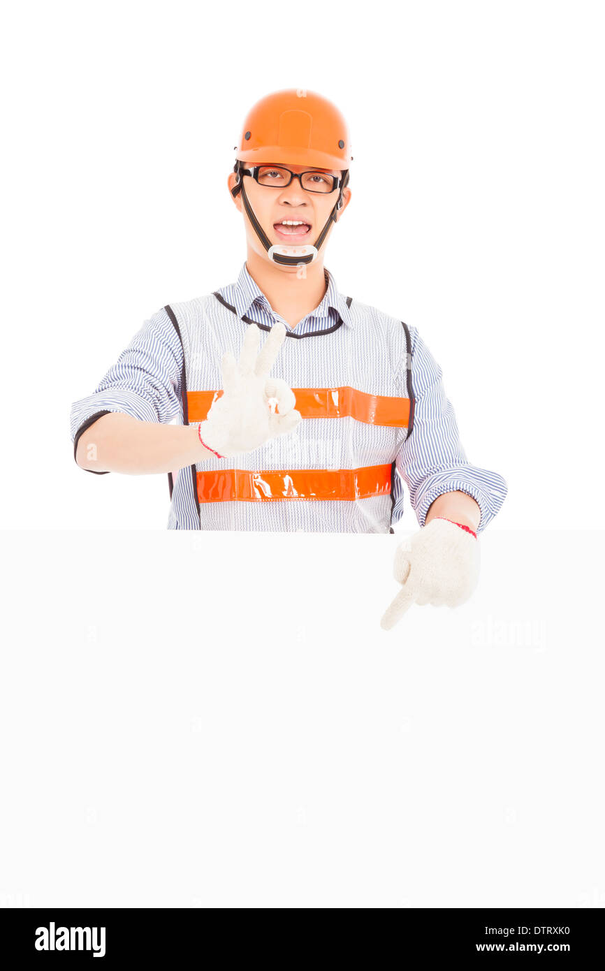 Male worker  make ok gesture with white board in studio Stock Photo