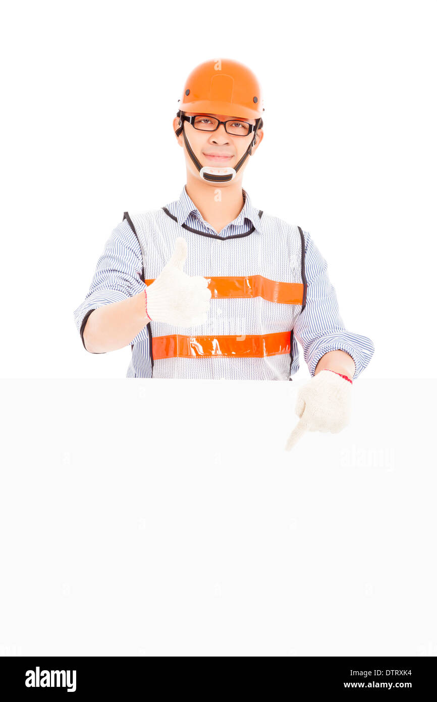 Male worker thumb up gesture and pointing to white board Stock Photo