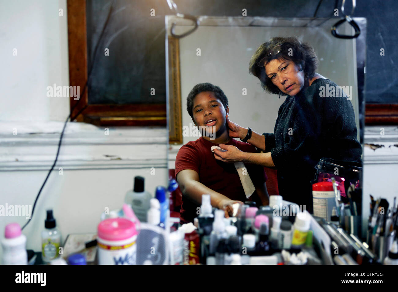 Memphis, TN, USA. 18th Feb, 2014. February 18, 2014 - 11-year-old RaJay Chandler (Benny) has makeup applied to his face by artist Gloria Belz in between takes for the film, ''Free In Deed, '' at The Cathedral of God Holy Word Temple Tuesday. © Yalonda M. James/The Commercial Appeal/ZUMAPRESS.com/Alamy Live News Stock Photo
