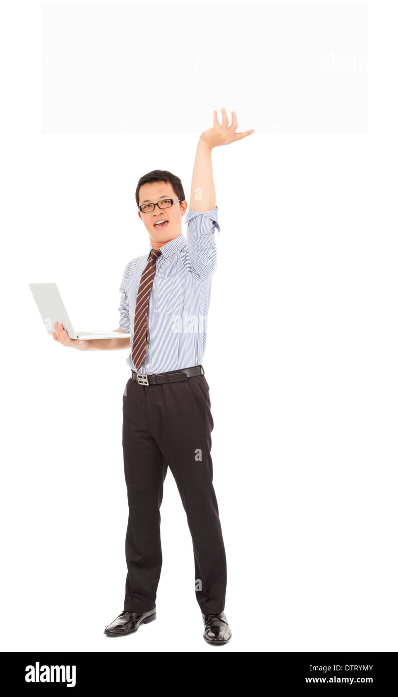 smiling computer engineer holding laptop and white board in studio Stock Photo