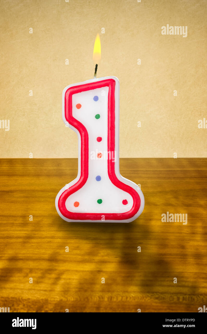 Burning birthday candle number 1 Stock Photo Alamy