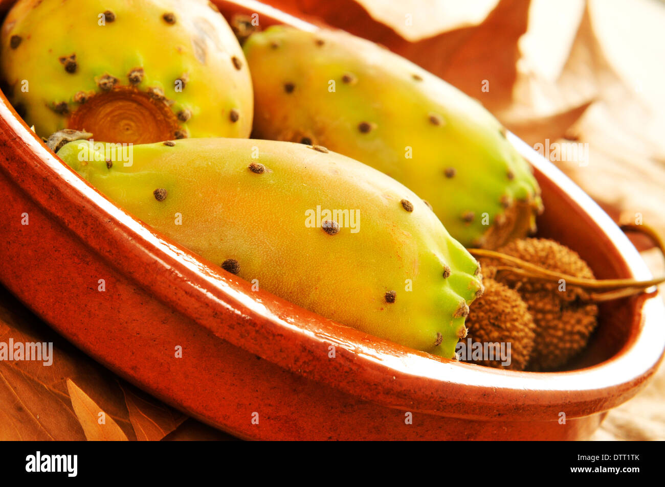 closeup of some prickly pear fruits in a earthenware bowl Stock Photo