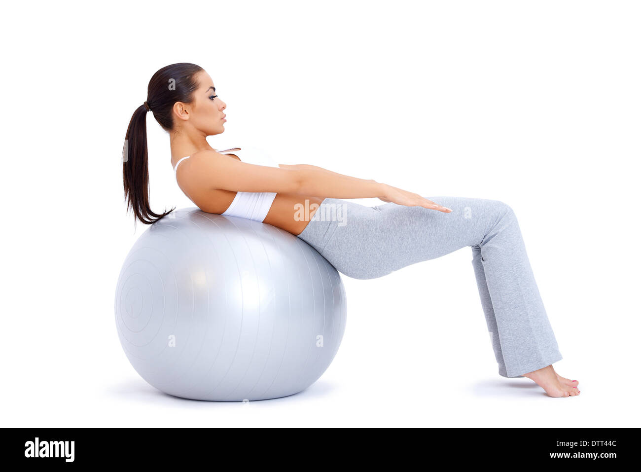 Doing abdominal muscles with fitness ball Stock Photo