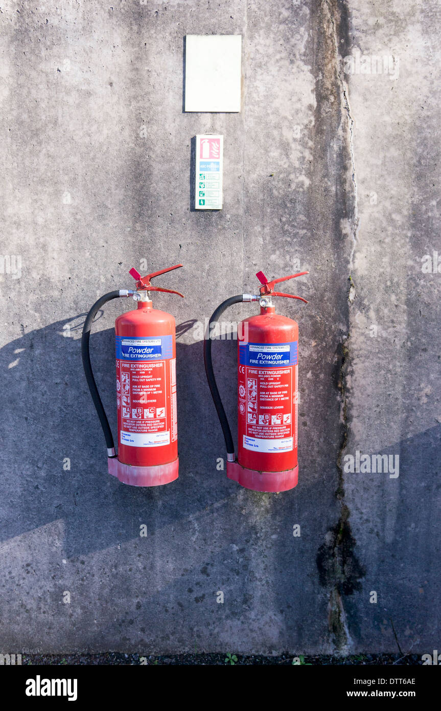 Powder fire extinguishers mounted on a wall Stock Photo Alamy