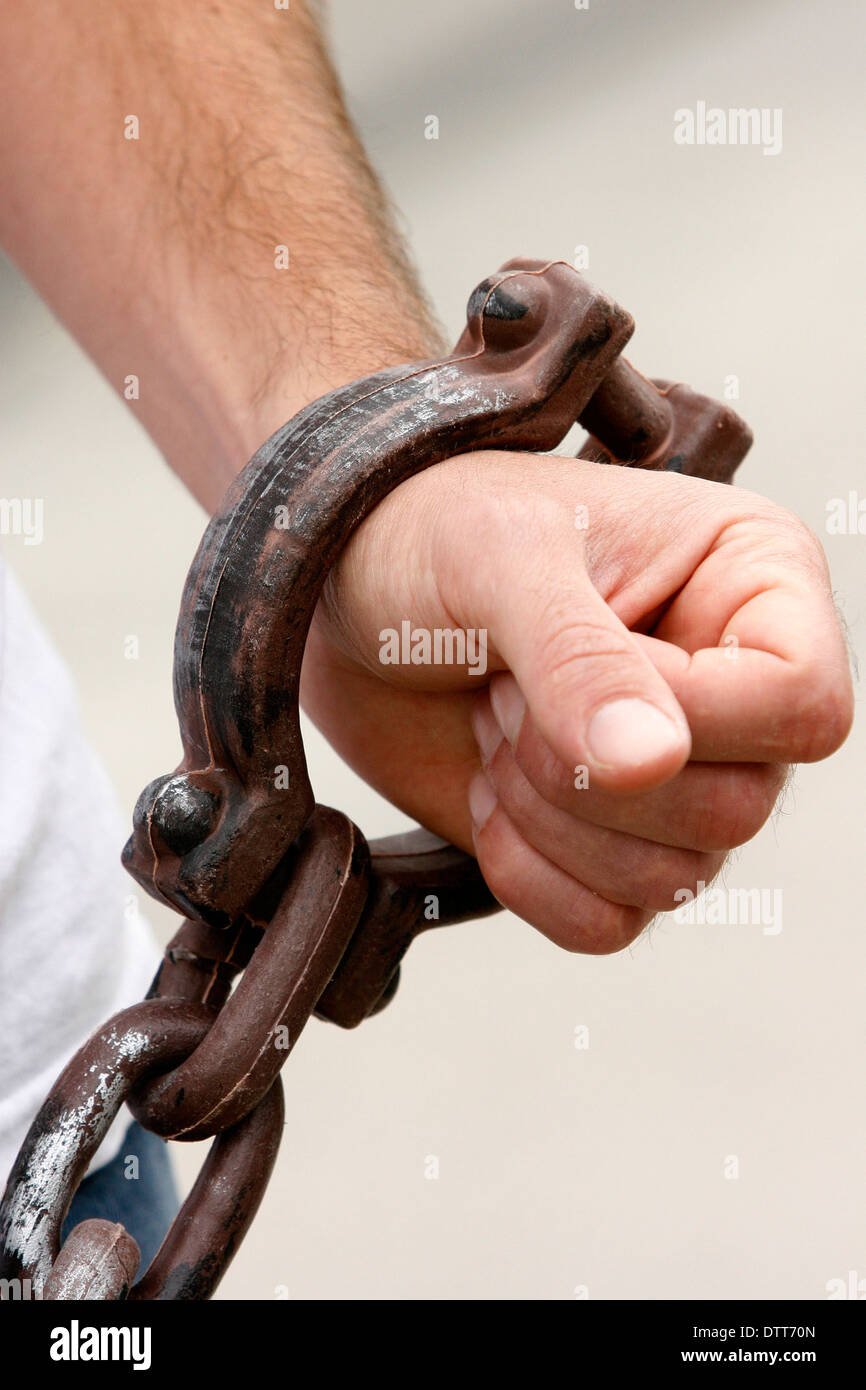 Amnesty International campaigner with shackles in London Stock Photo