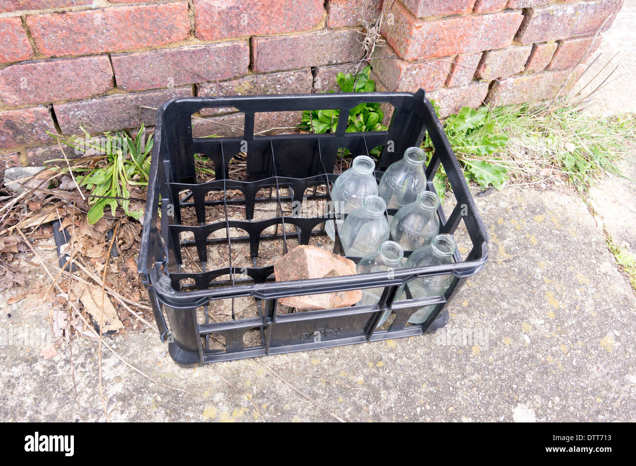 Empty glass milk bottles in plastic crate UK Stock Photo Alamy