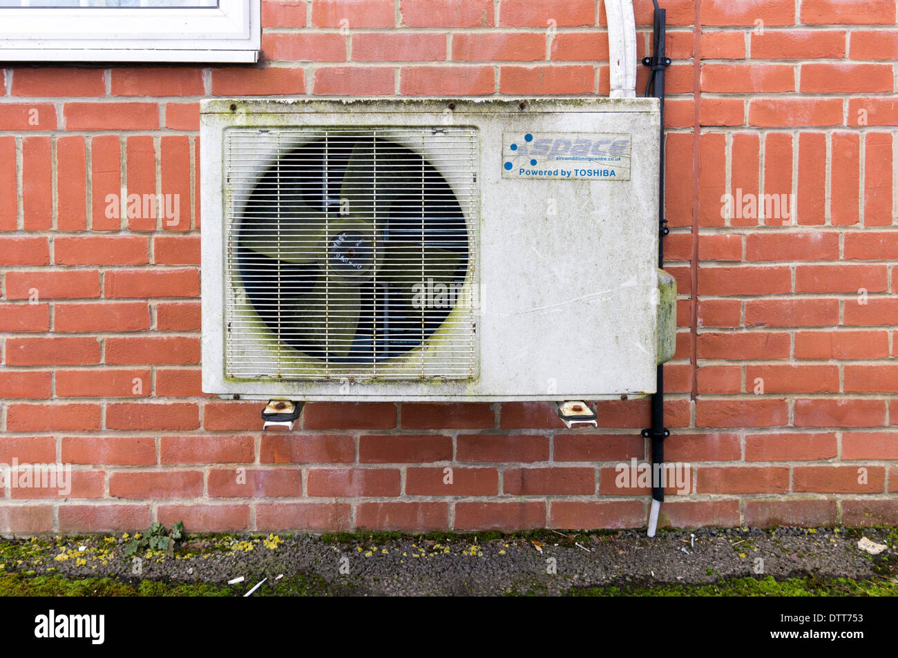 Old air conditioning unit and fan on brick wall Stock Photo Alamy