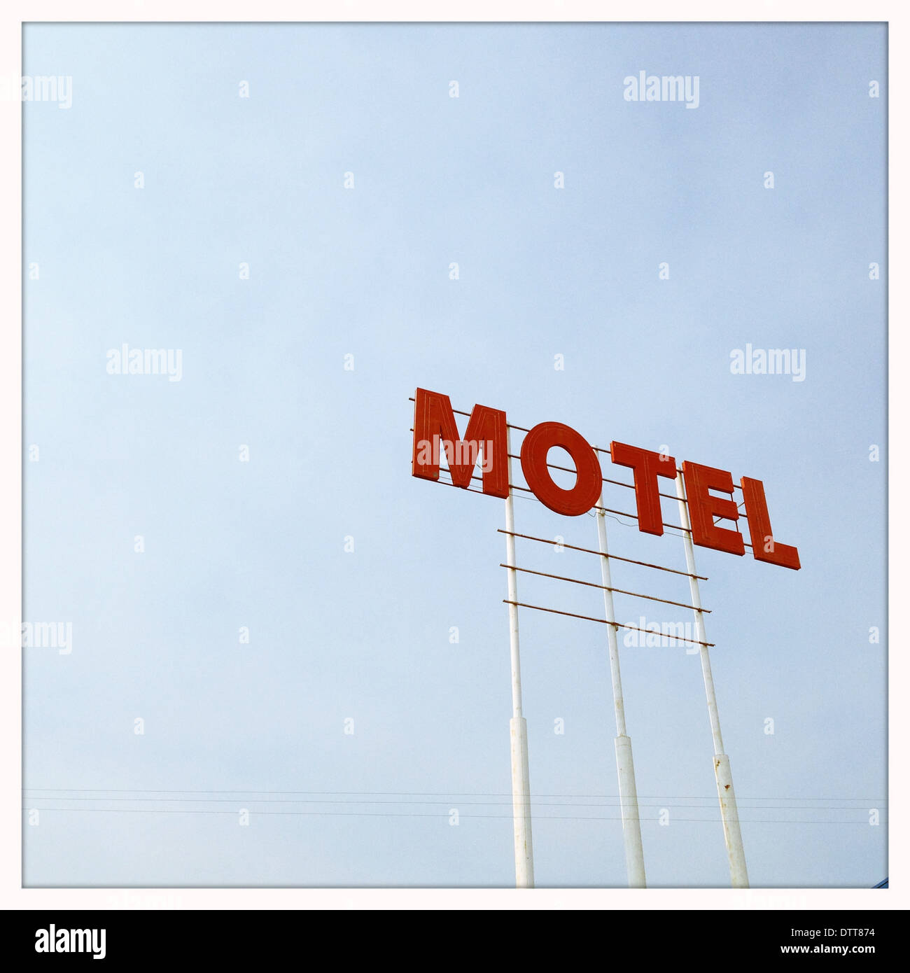 Red motel sign in blue sky Stock Photo