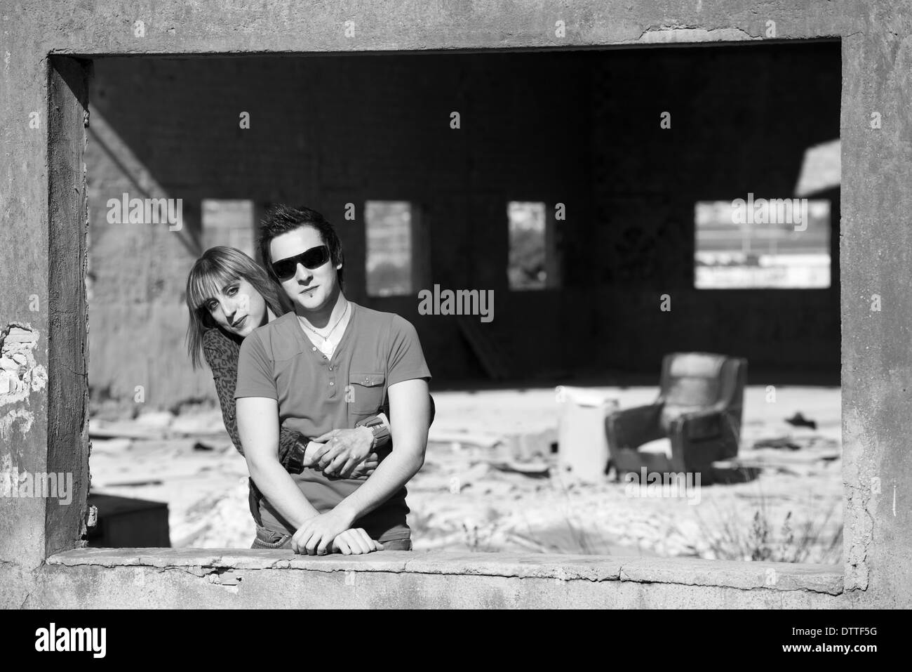 Black and white portrait of a couple inside a ruin Stock Photo
