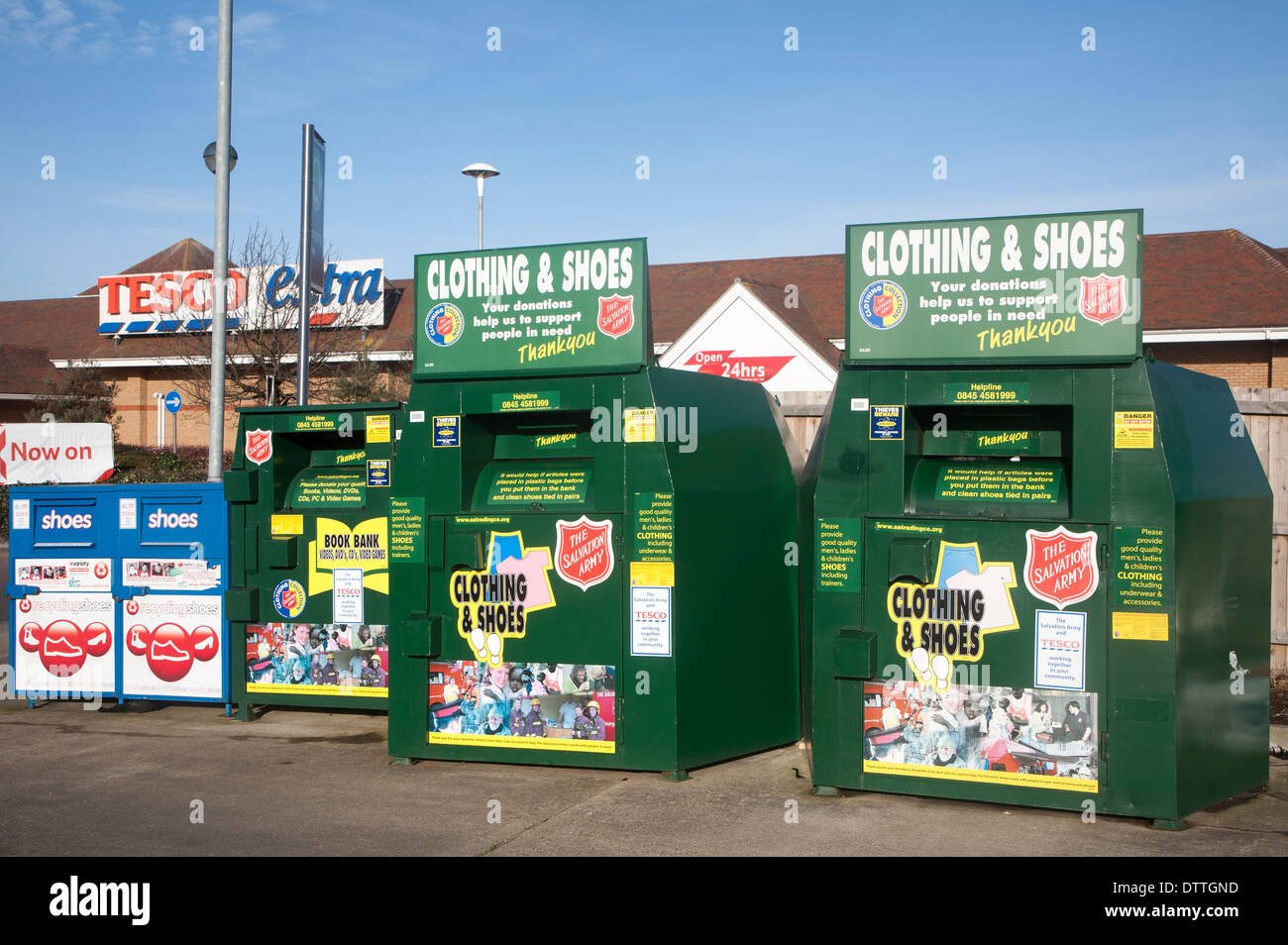 Clothing and Shoe recycling collection containers at a Tesco store, UK Stock Photo