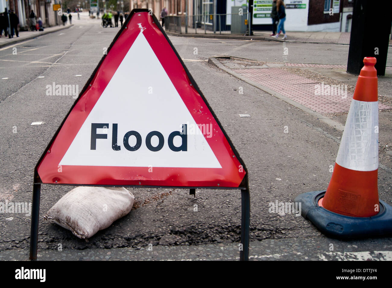 Temporary traffic sign warning of 'Flood' at a road block in Worcester city centre. Stock Photo