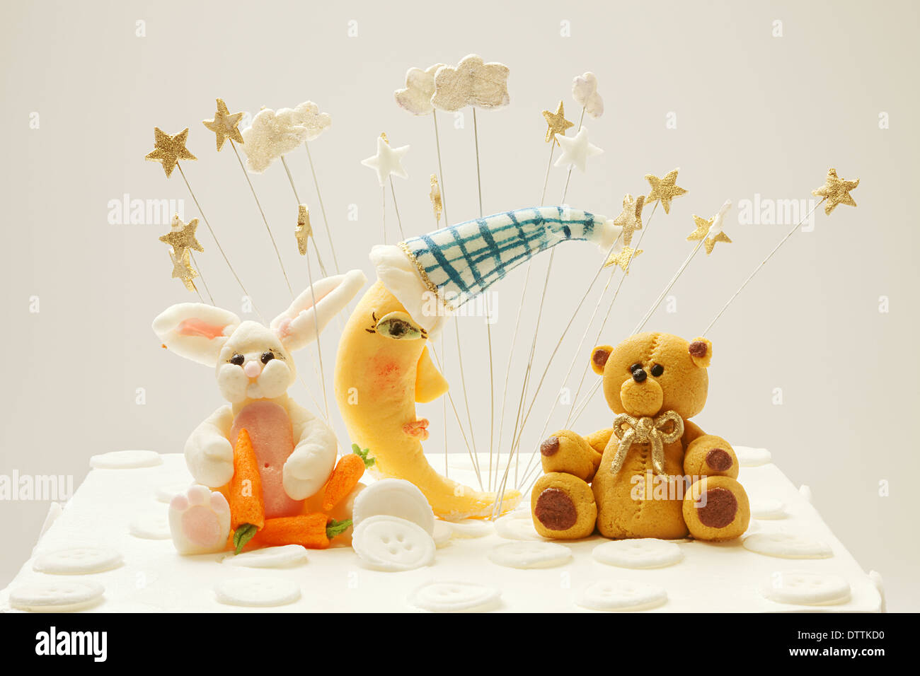 Birthday cake decoration, bear, moon and rabbit made of sugar, put on top  of cake Stock Photo - Alamy, image size:1300x956