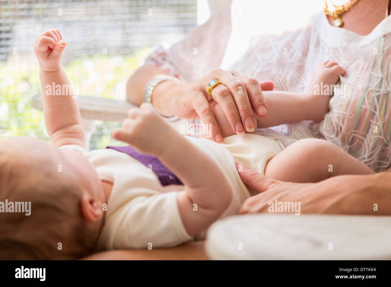 Caucasian mother playing with baby boy Stock Photo