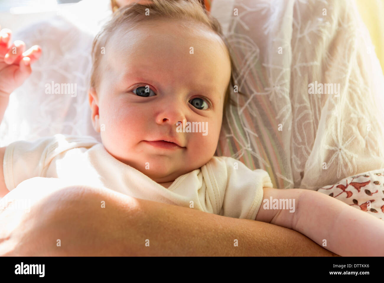 Mother holding smiling baby Stock Photo