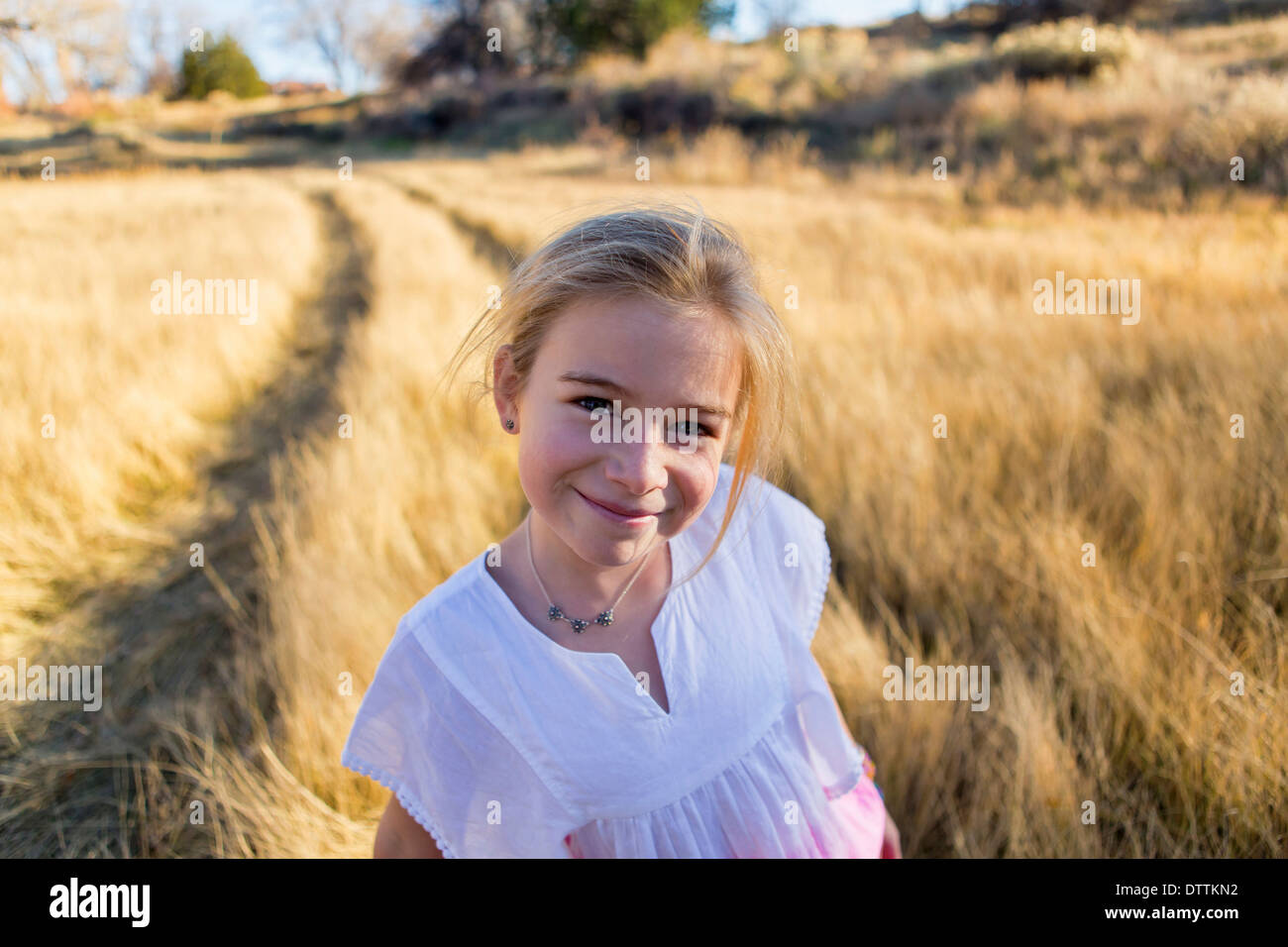 Caucasian girl smiling outdoors Stock Photo