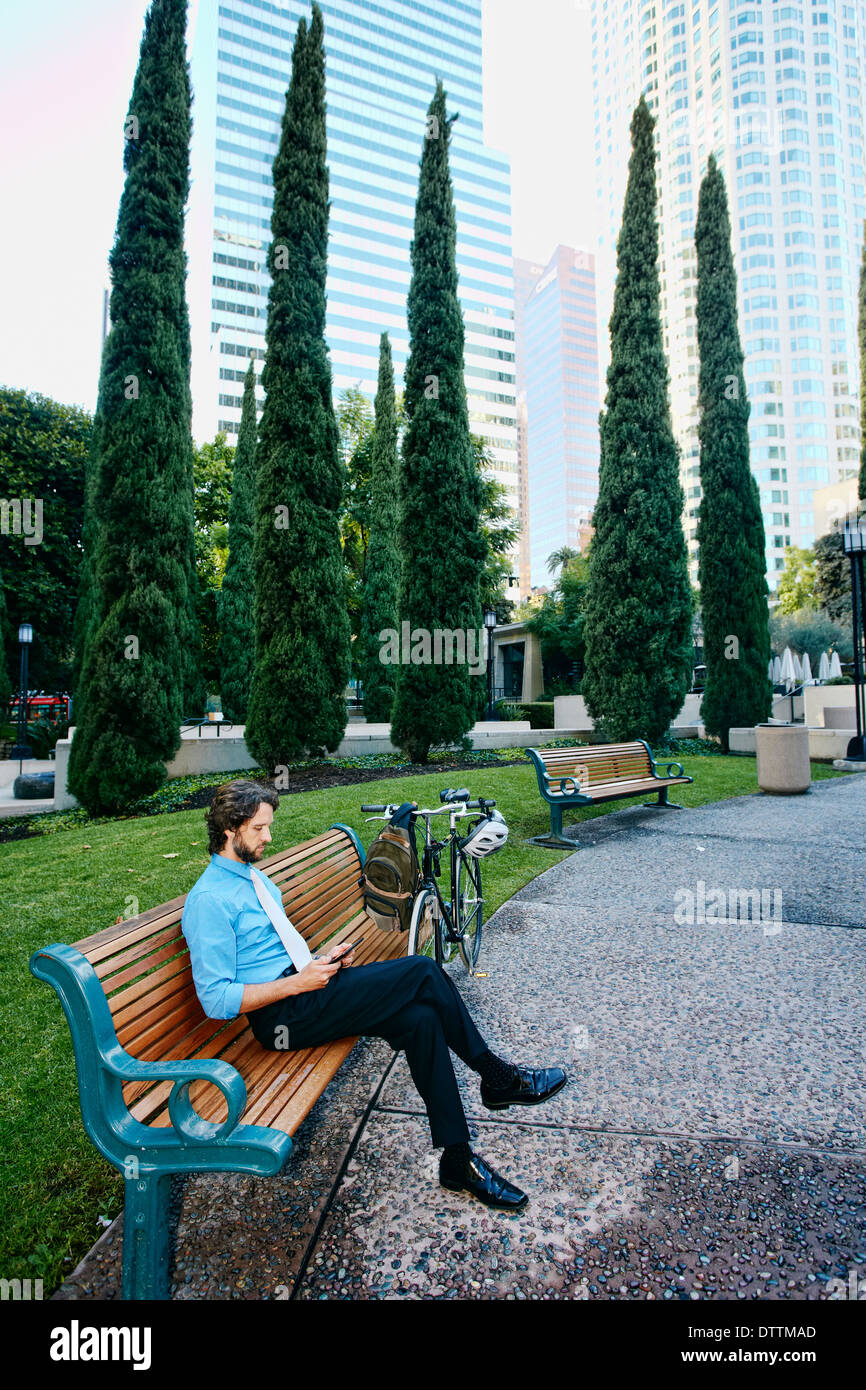 Caucasian businessman relaxing in urban park Stock Photo