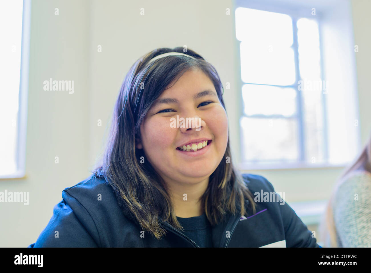 Native American student smiling in class Stock Photo