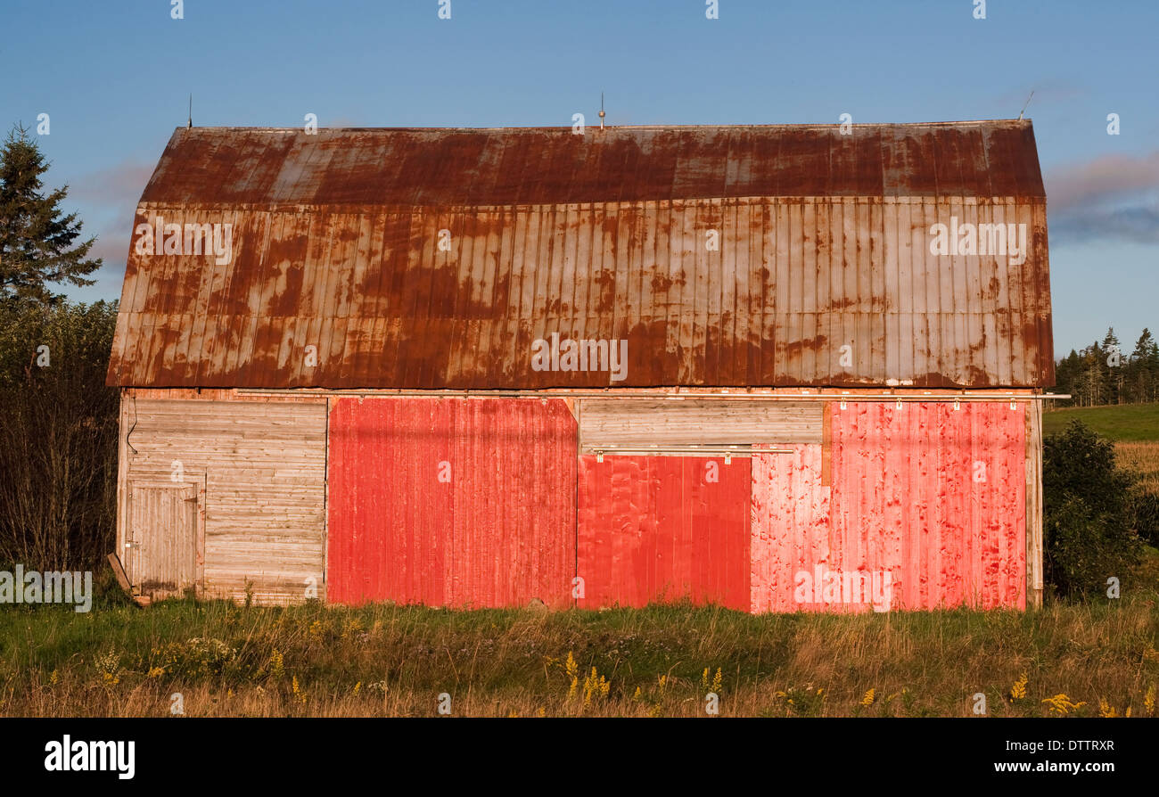 Old Barn With Faded Red Paint And Rusty Roof Stock Photo 66928479