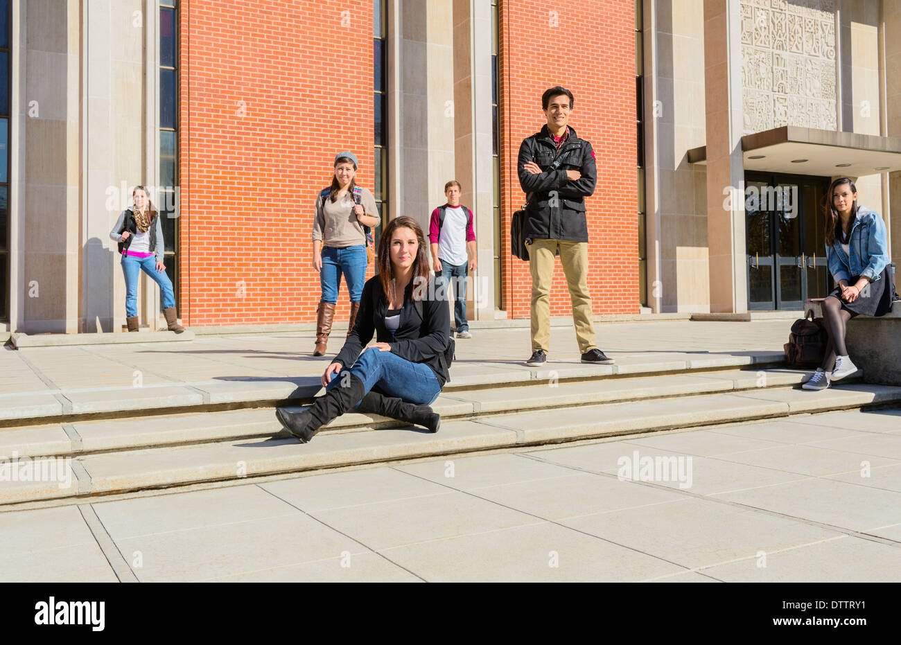 Students on campus steps Stock Photo