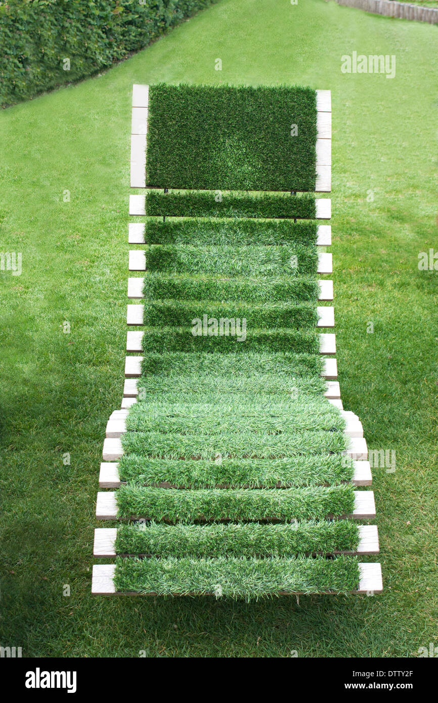 Garden lounger covered with artificial grass Stock Photo