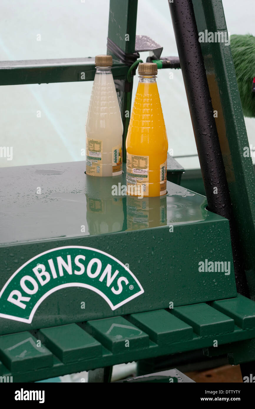 Drink bottles below umpires chair Wimbledon tennis court Stock Photo