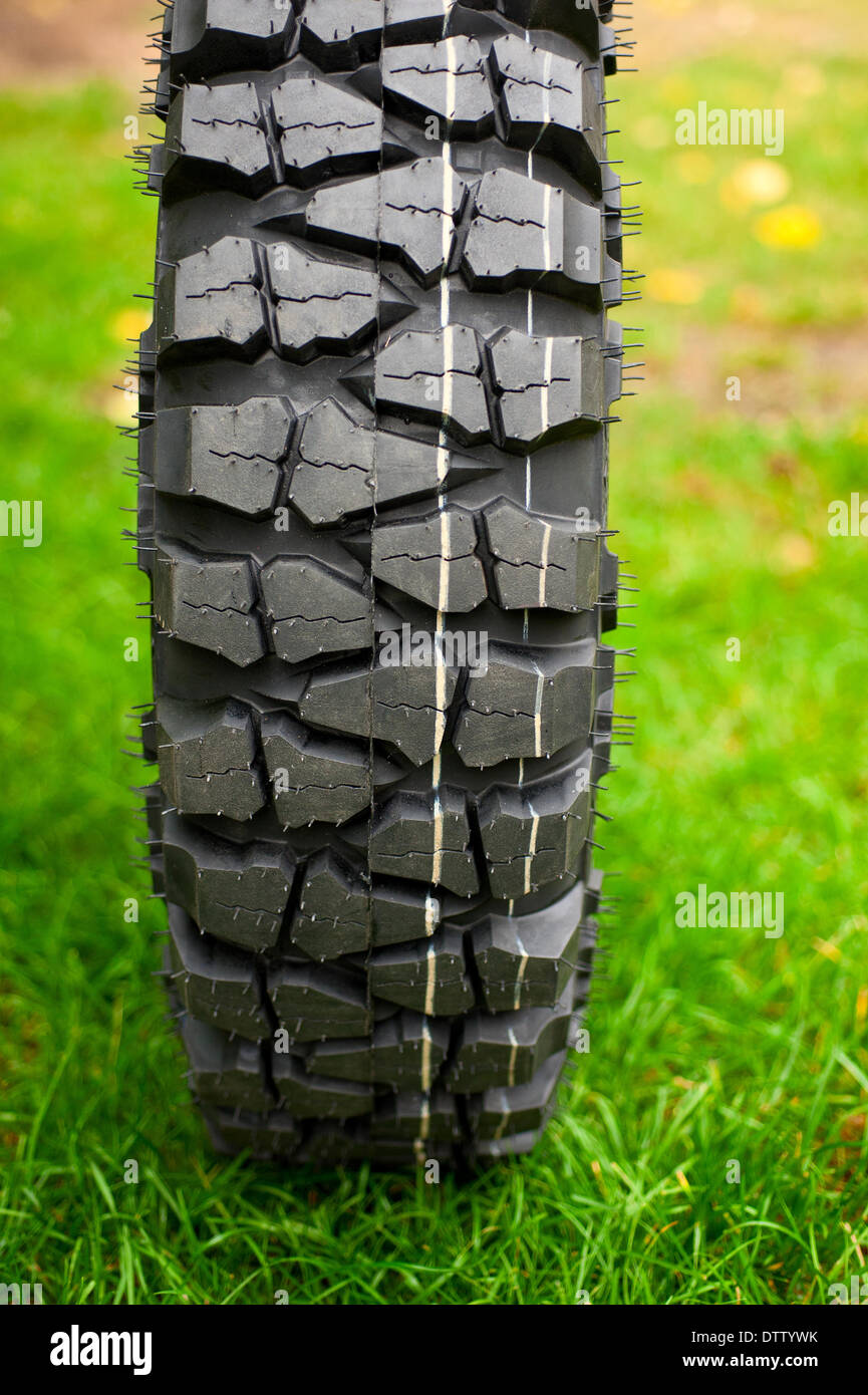 Tire at green grass Stock Photo Alamy