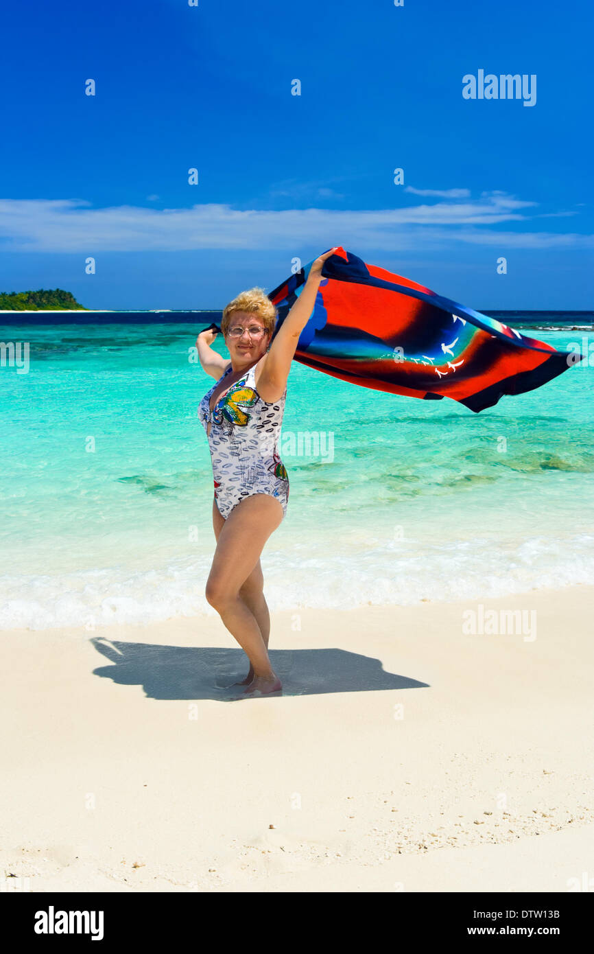 Happy woman on beach Stock Photo - Alamy