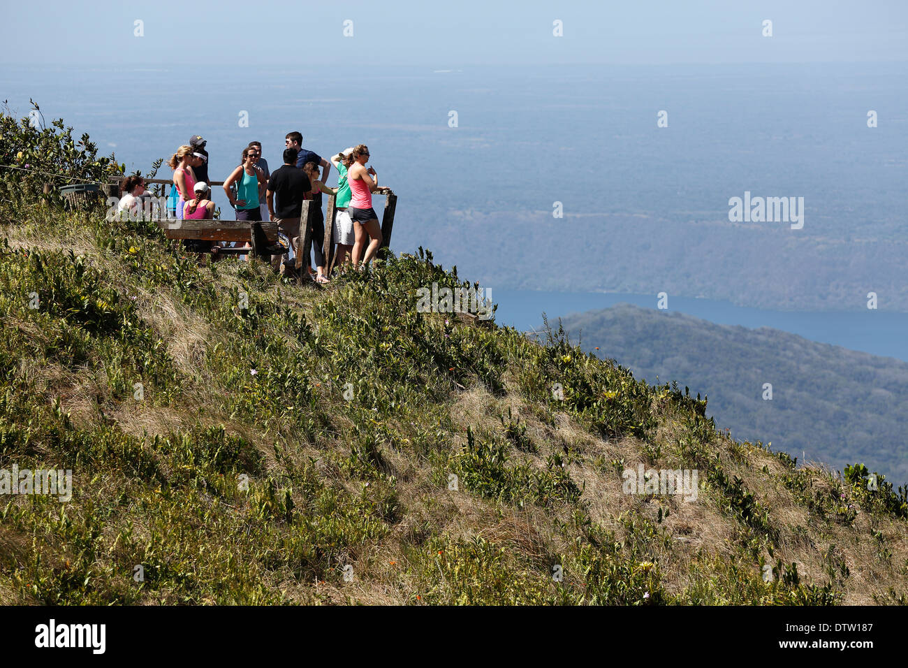 Tourists, scenic overlook on Mombacho volcano with view of Laguna de Apoyo  Nicaragua Stock Photo