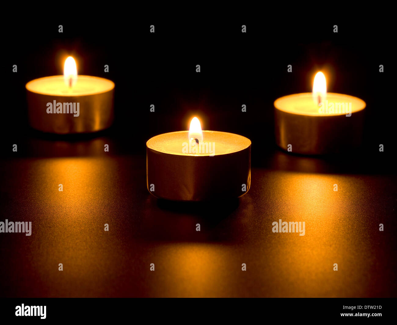 Three burning candles Stock Photo - Alamy