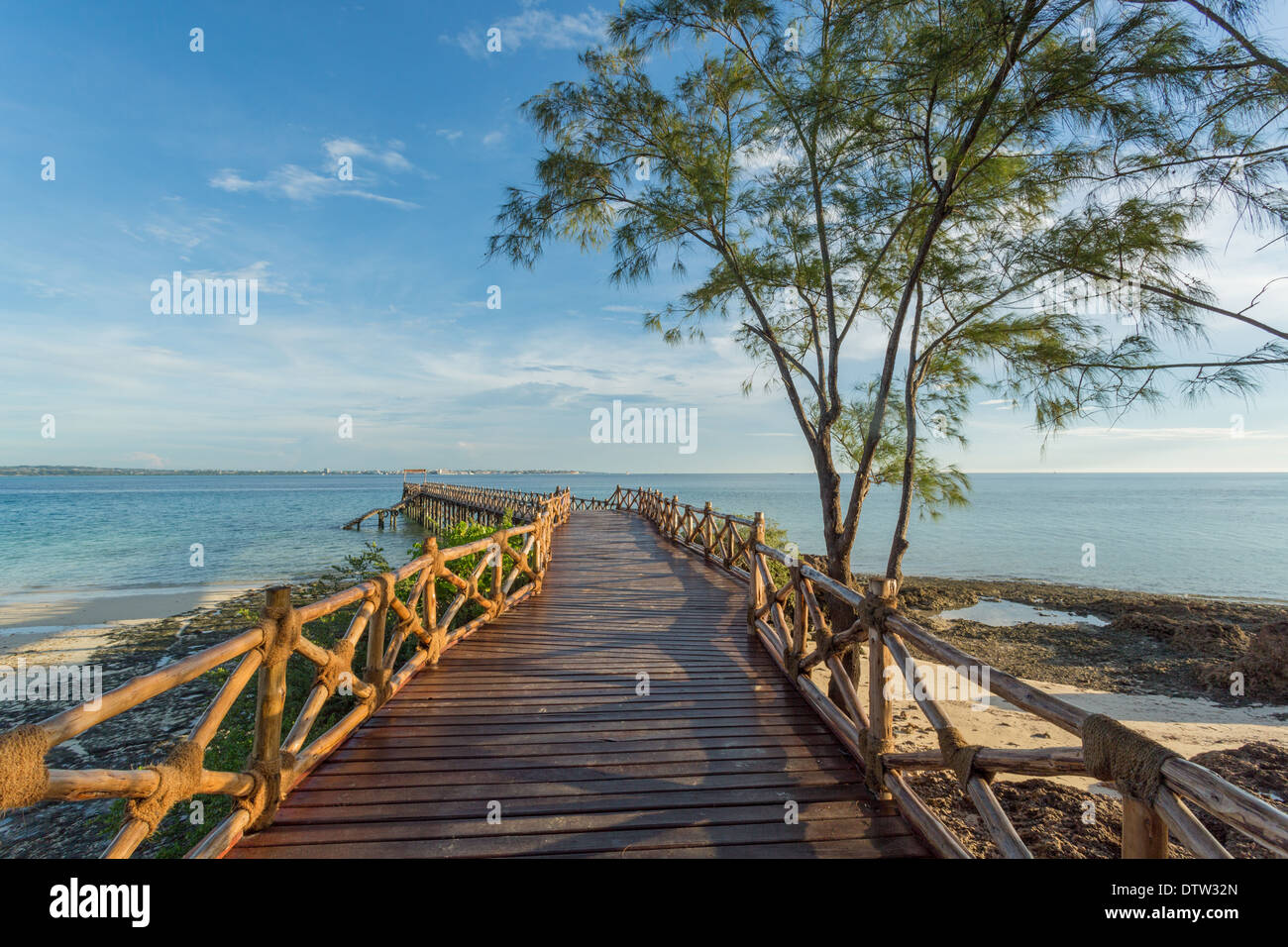 An old wooden pier on the Indian ocean built on the shores of Prison Island in Zanzibar, Tanzania Stock Photo