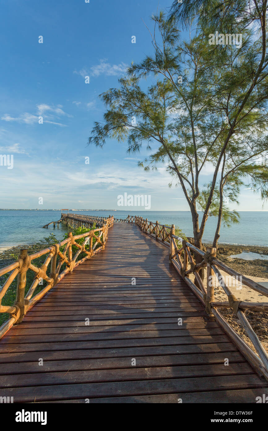 An old wooden pier on the Indian ocean built on the shores of Prison Island in Zanzibar, Tanzania Stock Photo