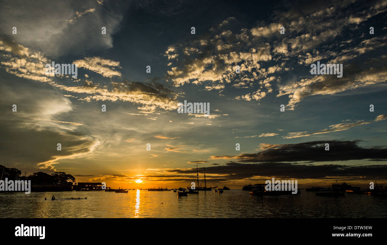 Sun setting the shores of the Indian Ocean in Zanzibar, Tanzania Stock Photo