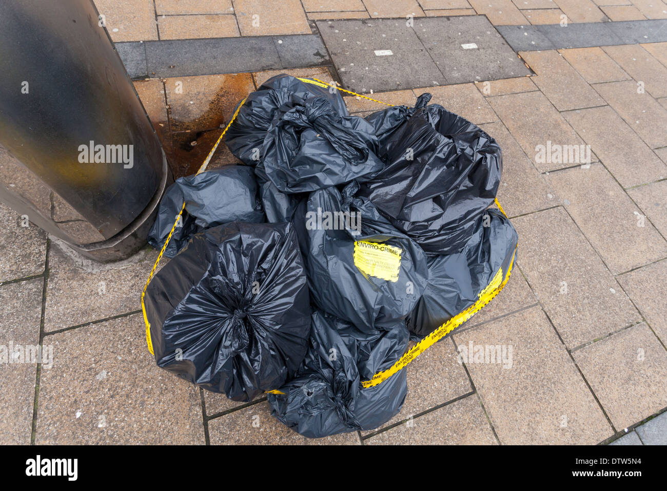 Environmental crime scene. Fly tipping or illegal dumping of waste. Bags of rubbish left on a street in Sheffield city centre, England, UK Stock Photo