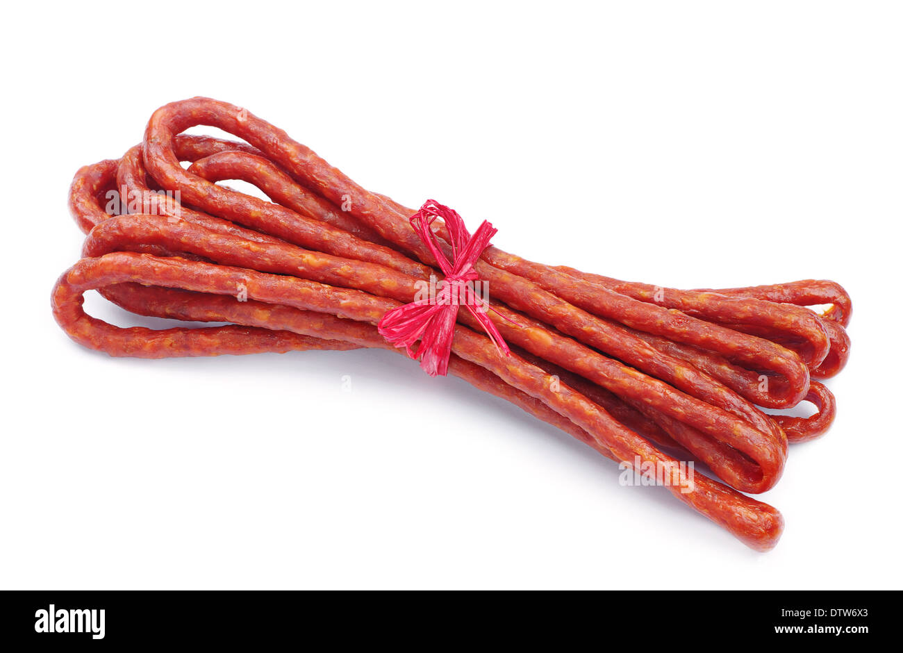 Long thin dry sausage on white background Stock Photo