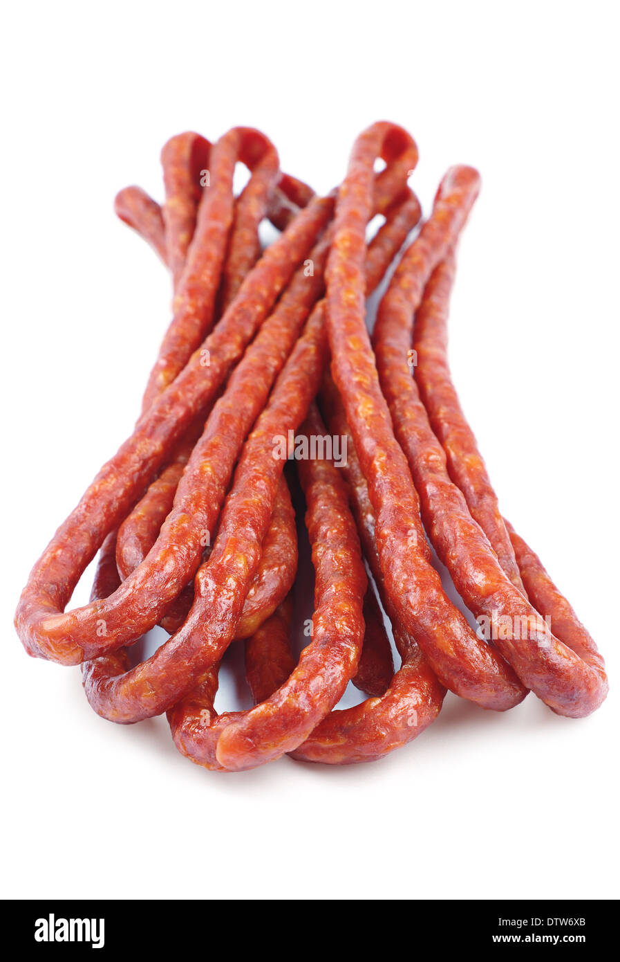 Thin sausages on white background. Sharpness in the foreground Stock Photo