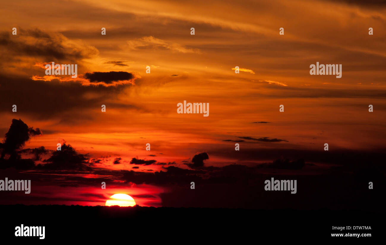 Plain sunsets are characterized by its red and orange intenses. Puerto Gaitan, Meta, Colombia. Stock Photo