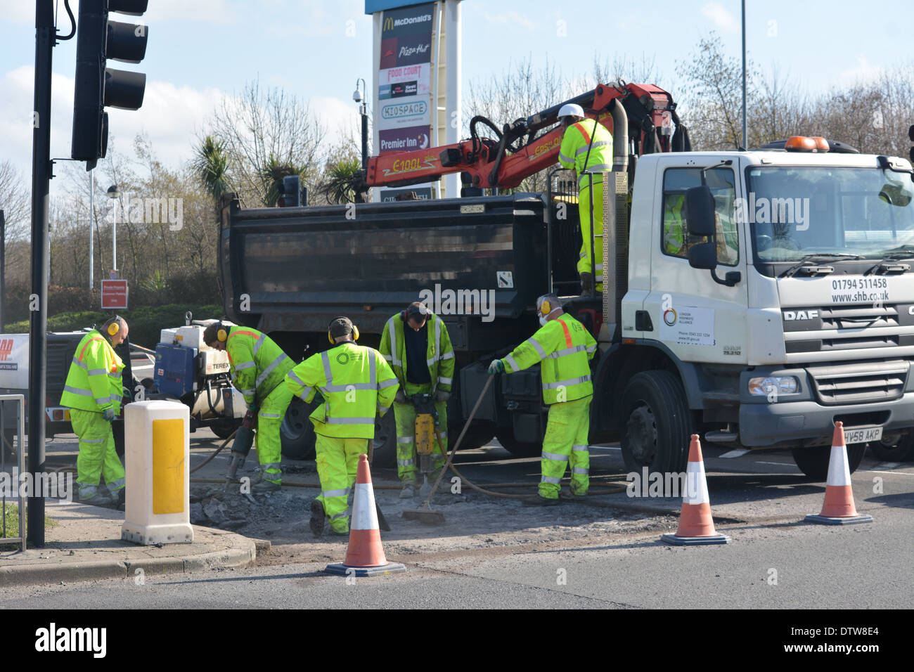 Workmen reparing road in UK Stock Photo