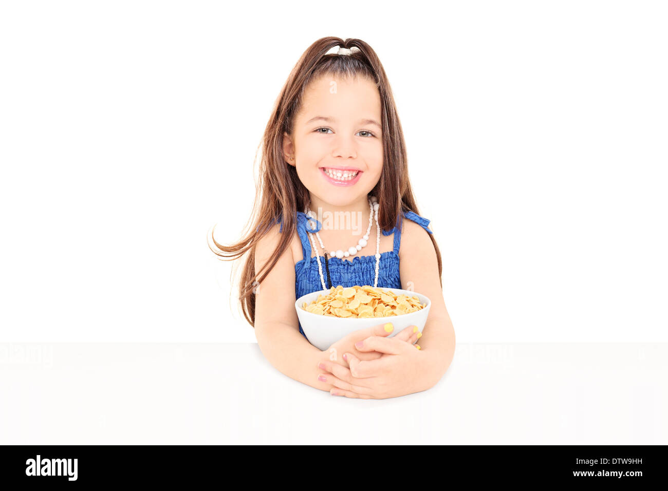 Cute little girl holding a bowl of cereal Stock Photo Alamy