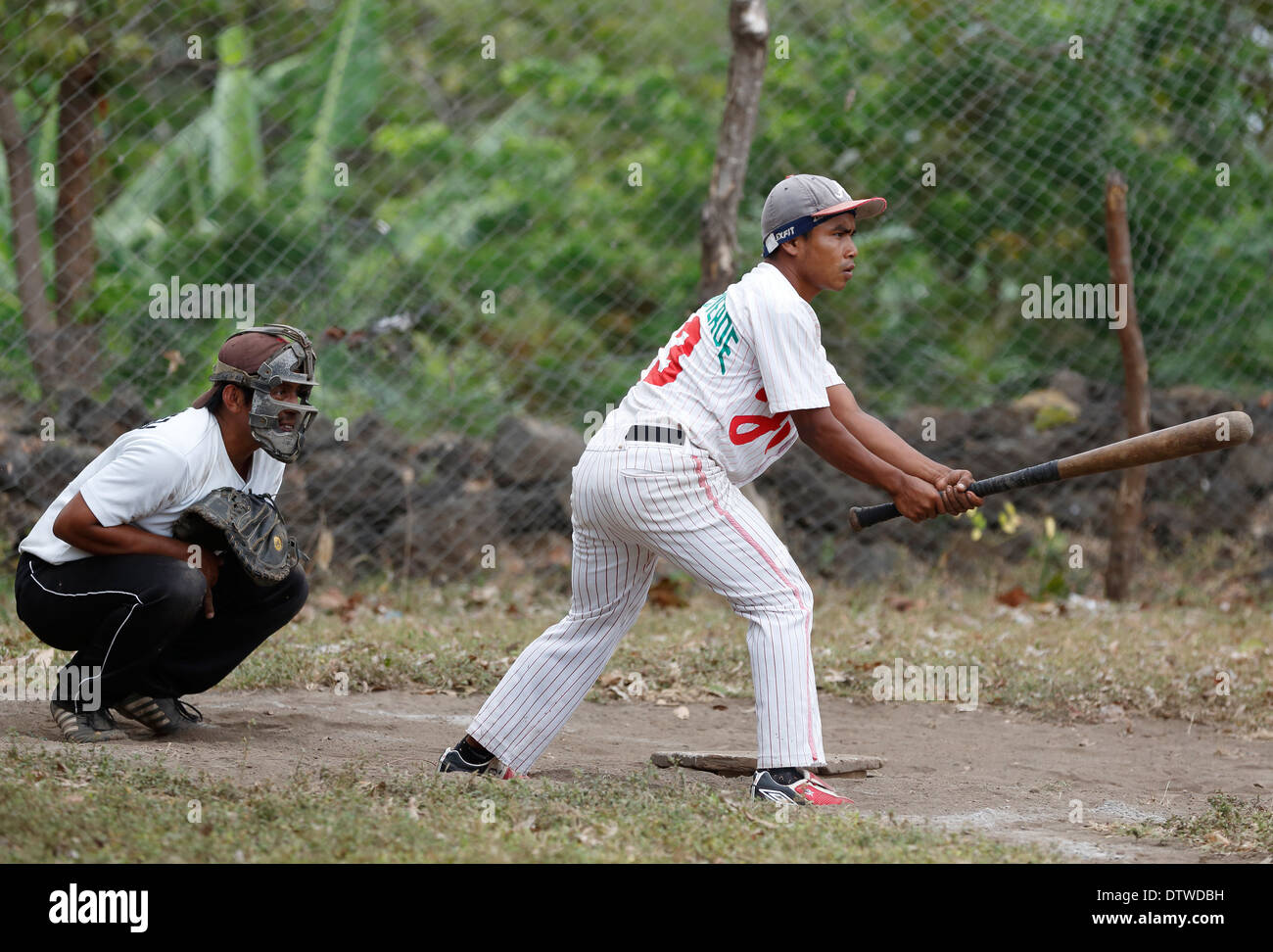 Batter and catcher, village baseball game, Ometepe Island, Nicaragua Stock Photo