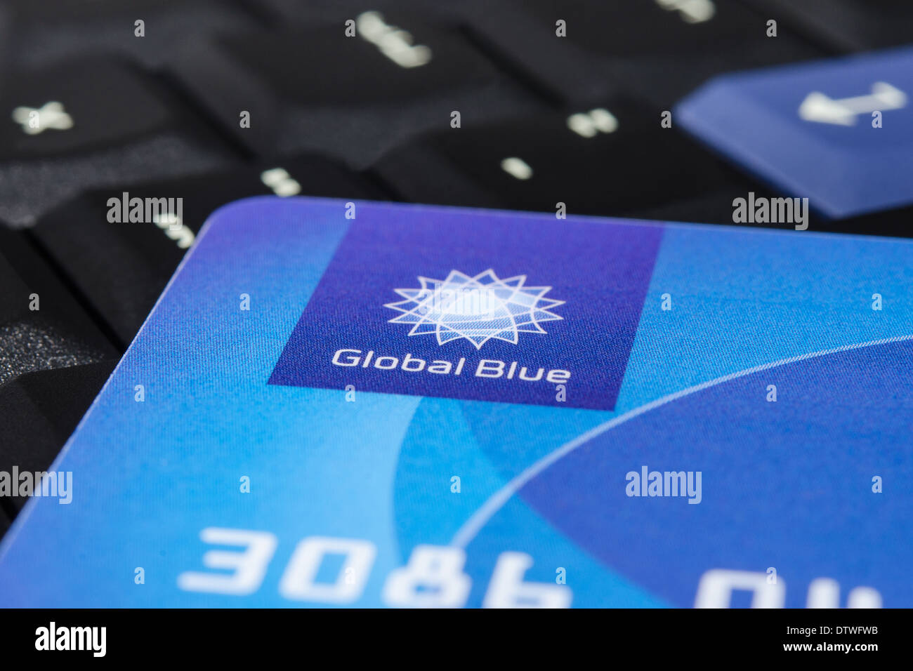 MUNICH, GERMANY - FEBRUAR 20, 2014: Plastic 'Global Blue' card on laptop ThinkPad keyboard. Easy for tax free shopping. Stock Photo