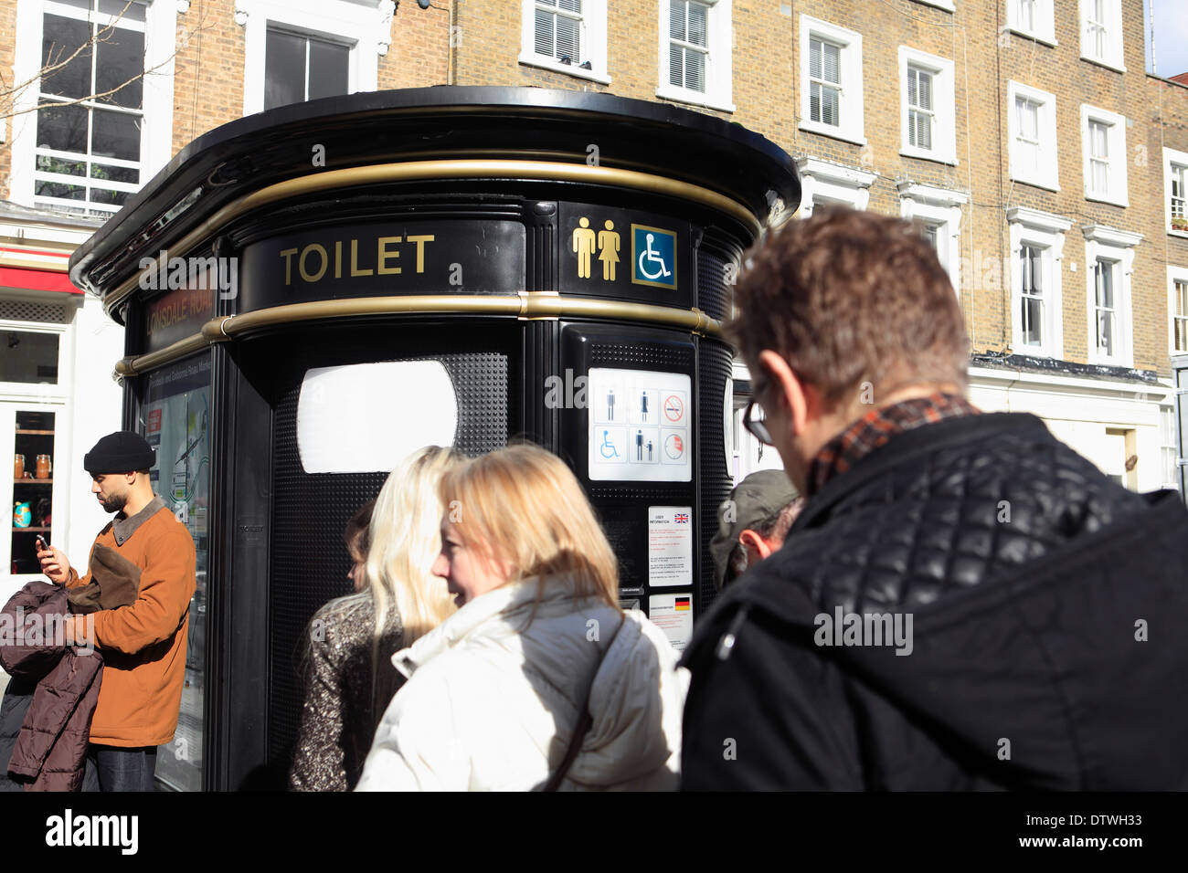 united kingdom london borough of kensington and chelsea lonsdale road queuing for a public toilet Stock Photo