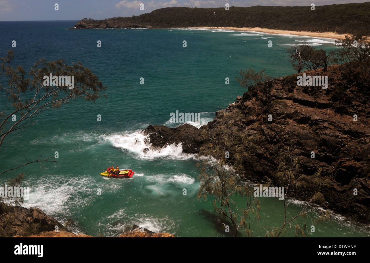 Surf patrol rescue boat in Hell's Gates, with Alexandria Bay in the background, Noosa National Park, Queensland, Australia Stock Photo
