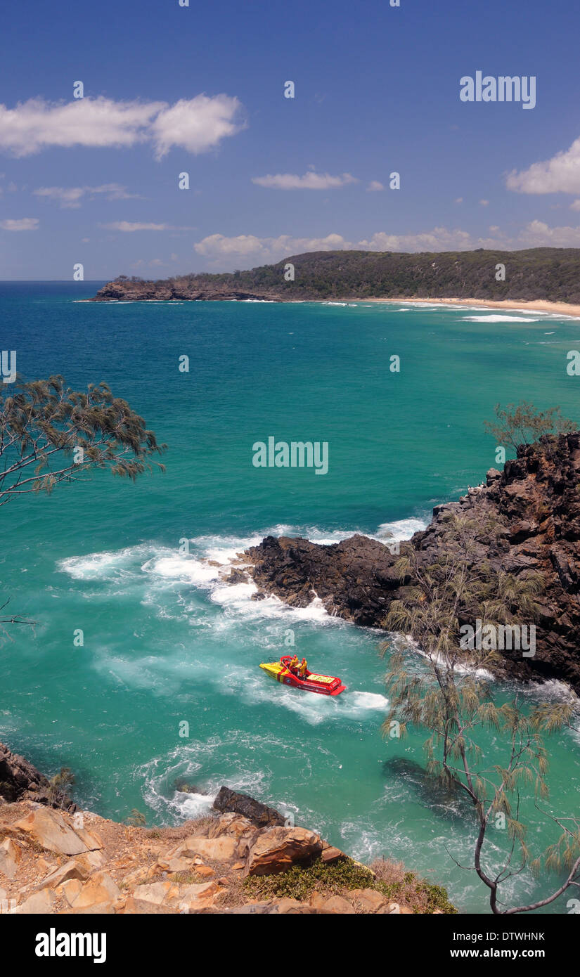 Surf patrol rescue boat in Hell's Gates, with Alexandria Bay in the background, Noosa National Park, Queensland, Australia Stock Photo