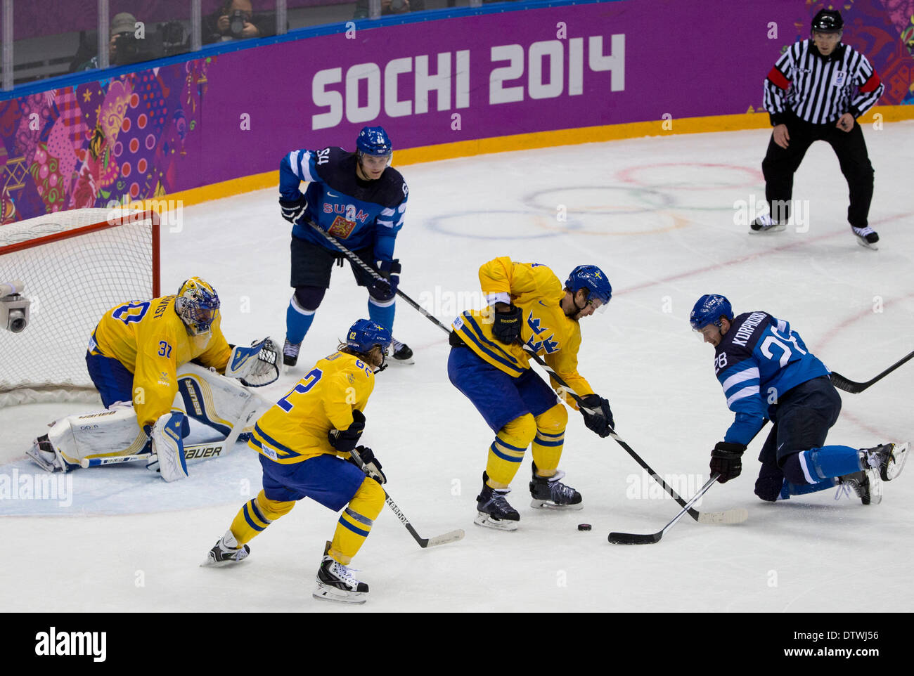 Feb. 21, 2014 - Sochi, Russia - Lauri Korpikoski of Finland battle Niklas Hjalmarsson of Sweden for puck in Mens' Ice Hockey Semi Finals at the Bolshoy Ice Dome during the Sochi 2014 Winter Olympic in Sochi, Russia. (Credit Image: © Paul Kitagaki Jr./ZUMAPRESS.com) Stock Photo