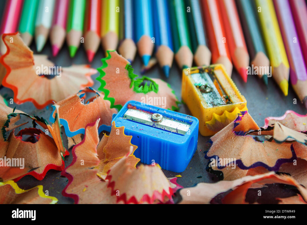 colorful pencils sharpeners spiral spire rubbish trash closeup colors sharp wooden colour chips Stock Photo