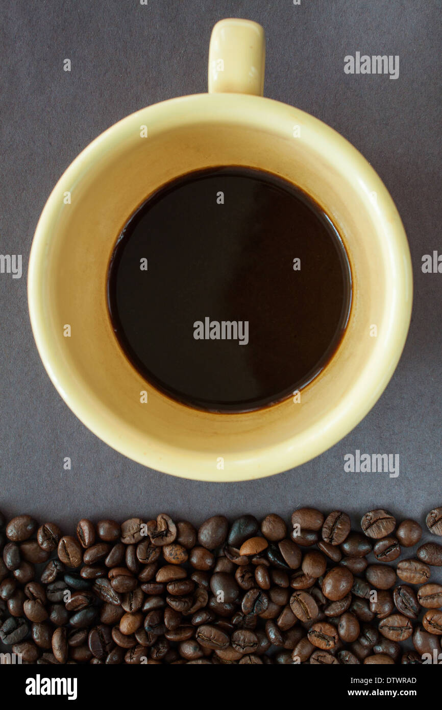 coffee beans cup 'above view' 'copy space' [dark background] drink liquid dark black vertical Stock Photo