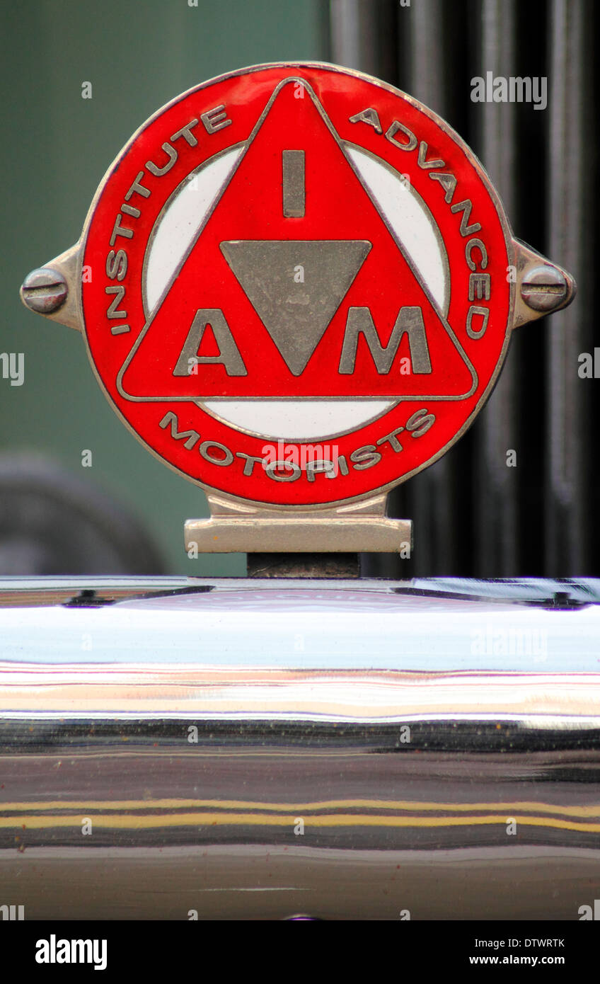 Vintage Institute of Advanced Motorists (IAM) membership badge on grille of a vintage car in England, UK Stock Photo